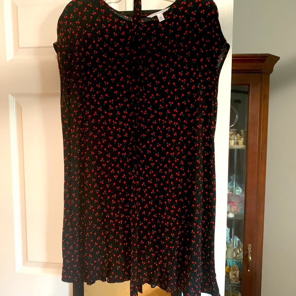 Red and black midi dress with tie around waist.